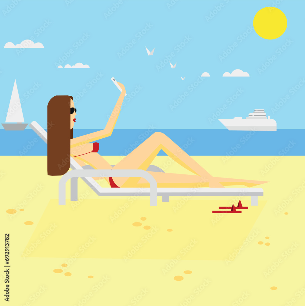 A girl on the beach sunbathing and blogging on the phone A girl on the beach sunbathing and blogging on the phone