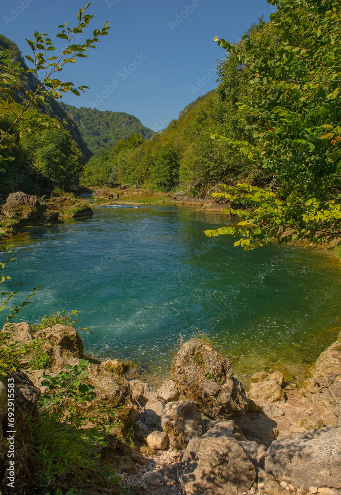 Fototapeta premium The River Una at the bottom of Strbacki Buk, a terraced waterfall on the border between the Federation of Bosnia and Herzegovina and Croatia. Early September