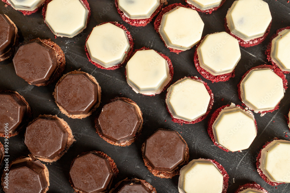 Small chocolate cake. Chocolate and cream tartlets cake. Top view Small chocolate cake. Chocolate and cream tartlets cake. Top view