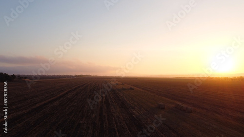 a beautiful dawn in a field of mown wheat