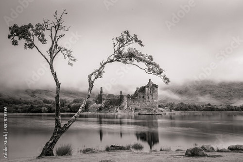 Kilchurcn Castle, Scottish castle near Oban in the Scottish Highlands. Famous castle landmark on Loch Awe Kilchurn castle is reflected in the water of the loch. Scotland, united Kingdom.  photo