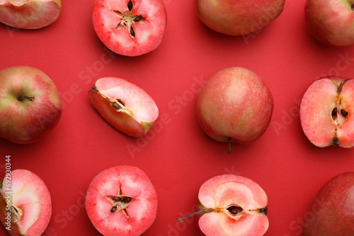 Tasty apples with red pulp on color background, flat lay photo