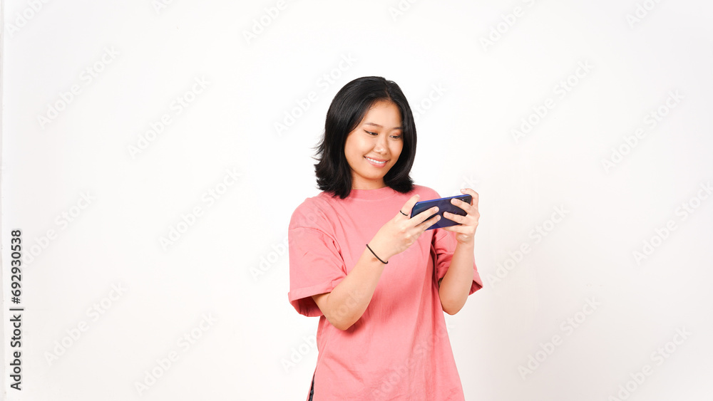 Happy asian woman playing game using mobile phone isolated on a white background. Happy asian woman playing game using mobile phone isolated on a white background.