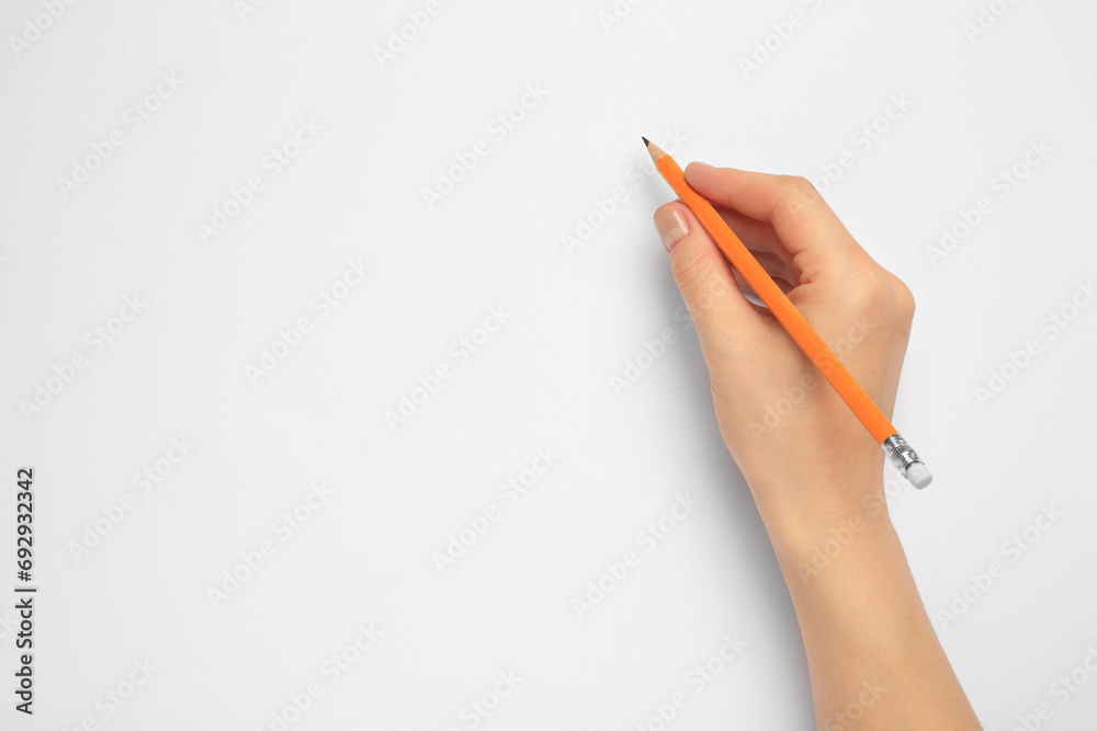 Woman with new graphite pencil on white background, top view. Space for text - obrazy, fototapety, plakaty 