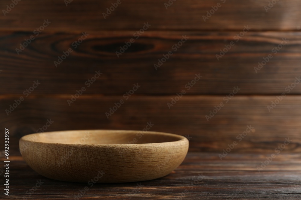 Beautiful bowl on wooden table, space for text Beautiful bowl on wooden table, space for text
