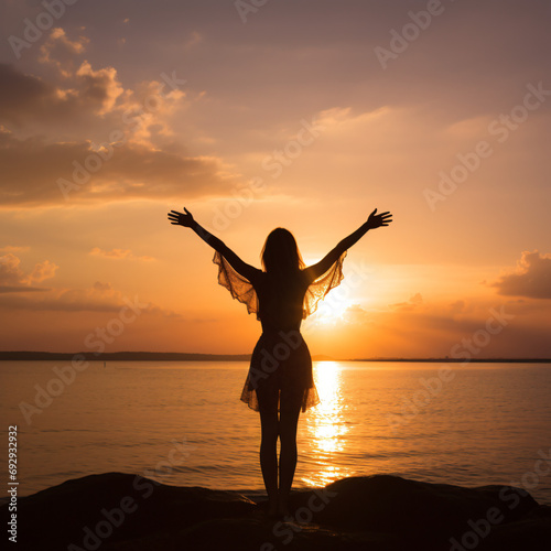 A silhouette of a woman with arms in the air, back to the camera, during sunset. Generated AI