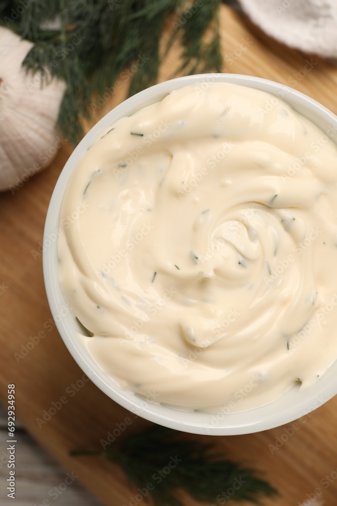 Tasty garlic sauce with dill on table, top view Tasty garlic sauce with dill on table, top view