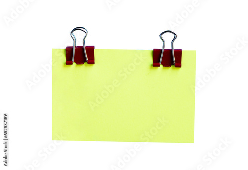 green sticky note with binder clip isolated on white background