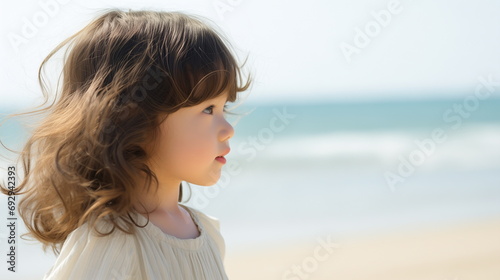 Side view of a Korean girl child on the beach, sunny day, copy space - Generative AI