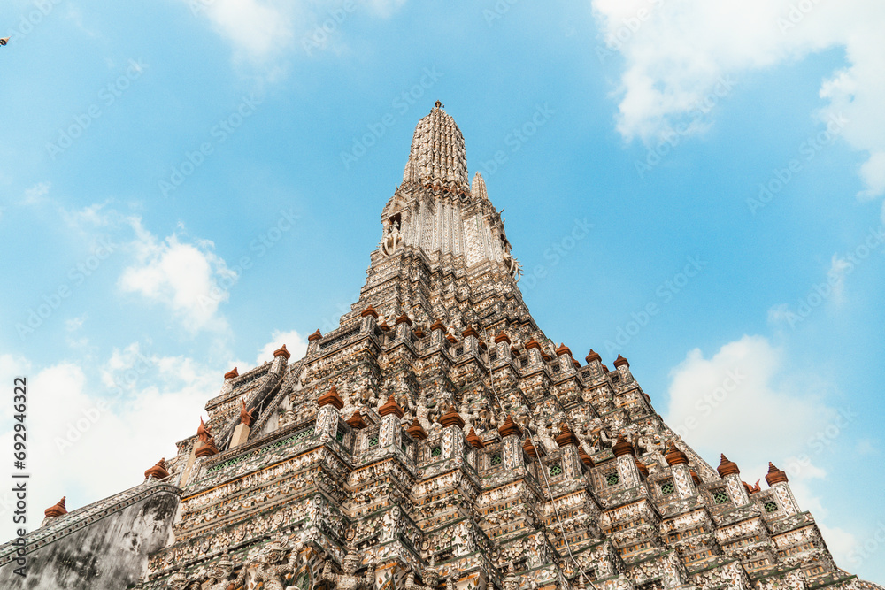 Wat Arun Temple of dawn the famous beautiful landmark in Bangkok Thailand. Wat Arun temple in a blue sky. Wat Arun is a Buddhist temple.