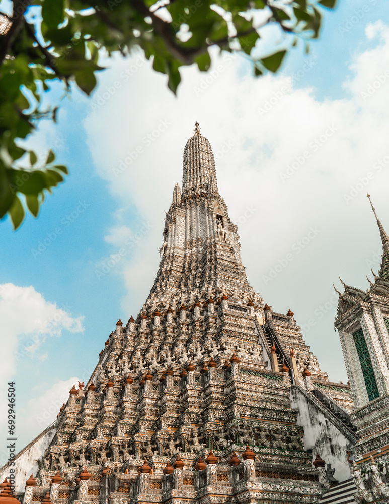 Wat Arun Temple of dawn the famous beautiful landmark in Bangkok Thailand. Wat Arun temple in a blue sky. Wat Arun is a Buddhist temple.