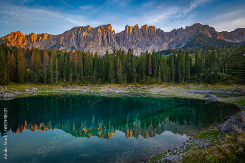 Lago di Carezza's emerald waters, misty forests, and Latemar views create an unparalleled Alpine charm photo