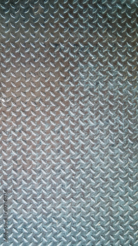 Abstract photograph with texture of stainless steel sheet, steel plate, non-slip used in industrial plants. Anti-slip stainless steel sheet Non-Slip Bottom Steel Plate 