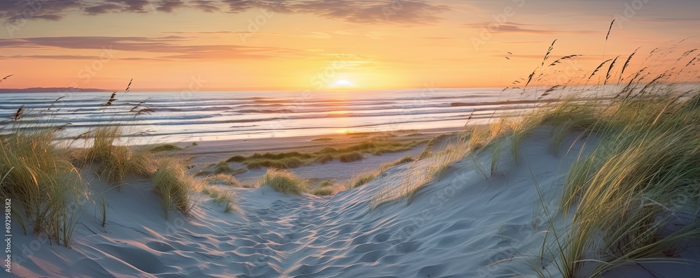 Capturing beauty of coast. Sunset at beach. Sun dips below horizon casting warm glow on sand dunes and gentle waves. Idyllic seascape with calm waters and colorful sky invites reflection and peace Capturing beauty of coast. Sunset at beach. Sun dips below horizon casting warm glow on sand dunes and gentle waves. Idyllic seascape with calm waters and colorful sky invites reflection and peace