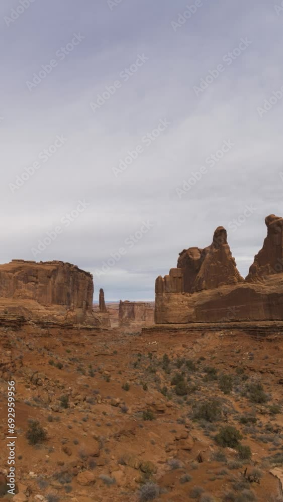 Park Avenue on a Cloudy Day. Spires and Pinnacles. Arches National Park, Utah, USA. Motion Time Lapse. Vertical Video Park Avenue on a Cloudy Day. Spires and Pinnacles. Arches National Park, Utah, USA. Motion Time Lapse. Vertical Video