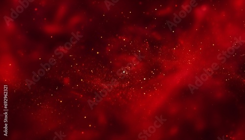 Red liquid with tints of golden glitters. Red background with a scattering of gold sparkles. photo