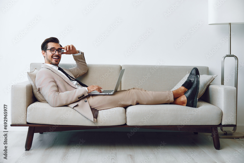 Man business online caucasian home white video smiling call laptop couch networking sofa Man business online caucasian home white video smiling call laptop couch networking sofa