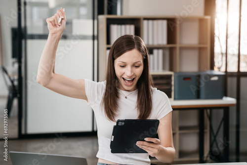 Free Download Overjoyed charming excited caucasian woman business woman worker using smartphone and laptop working in office, feeling happy. - GFXLoad