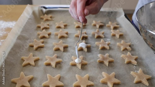 Preparing Christmas cookies, hands, making dough, baking.