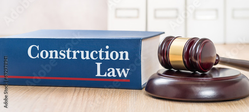 A law book with a gavel - Construction law
