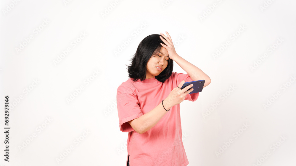 Young Asian woman in pink t-shirt Playing Mobile Game on Smartphone isolated on white background Young Asian woman in pink t-shirt Playing Mobile Game on Smartphone isolated on white background