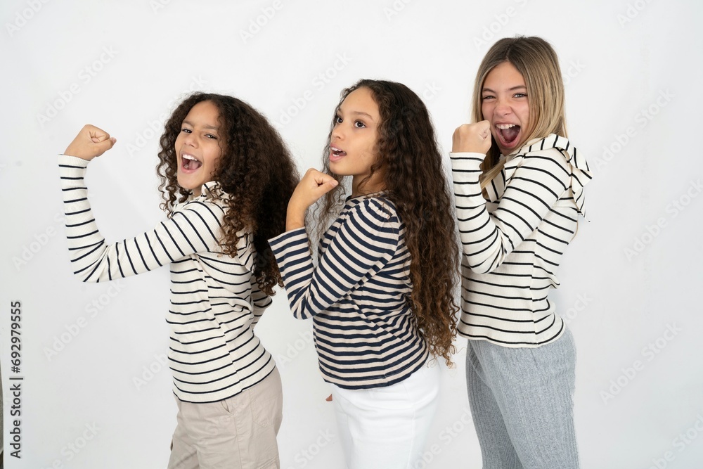 Profile side view portrait multi racial group of girl friends celebrates victory Profile side view portrait multi racial group of girl friends celebrates victory