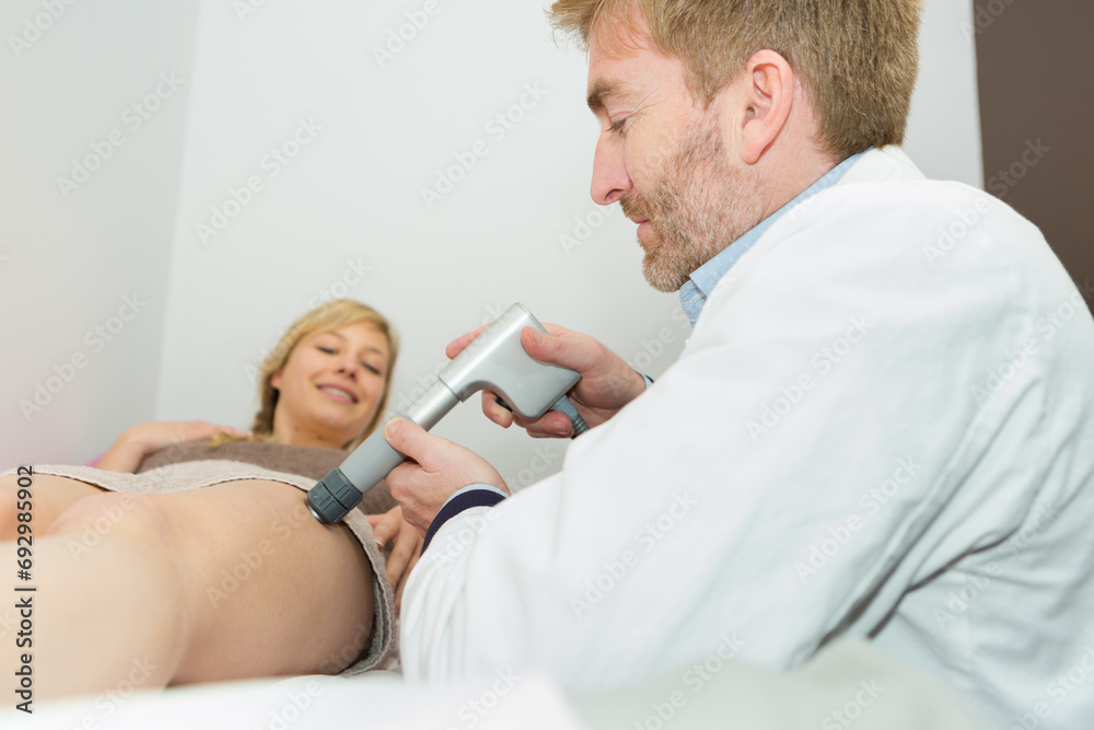 Fototapeta premium doctor treating the womans vain problem