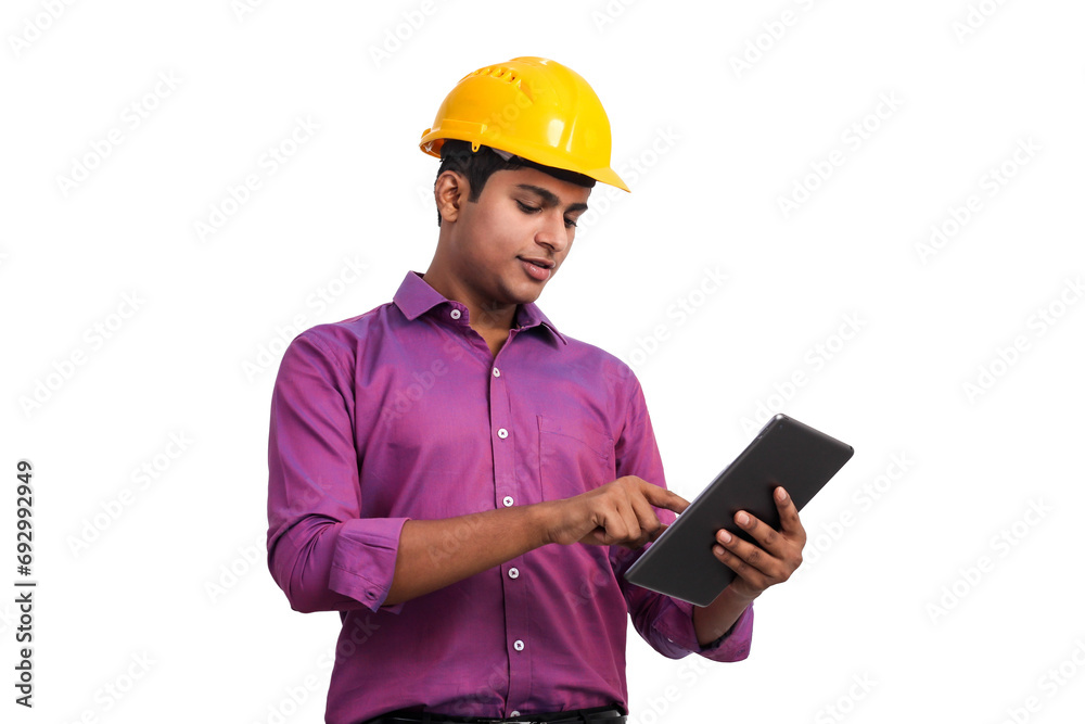Handsome indian man wearing yellow hardhat posing with tablet in studio. Handsome indian man wearing yellow hardhat posing with tablet in studio.