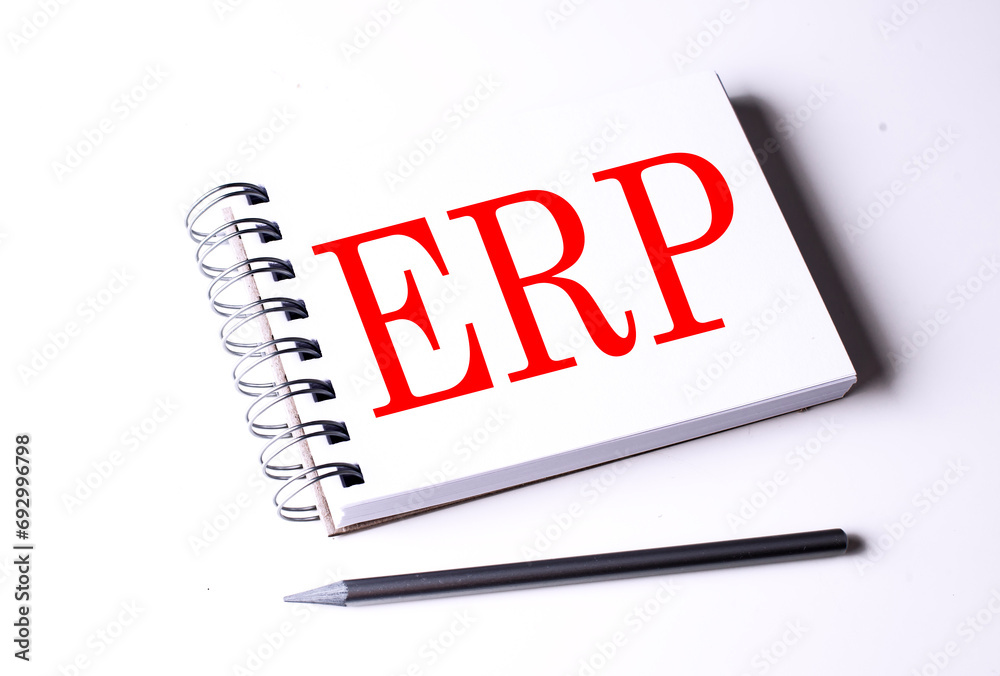 Text ERP on notebook on the white background, business Text ERP on notebook on the white background, business