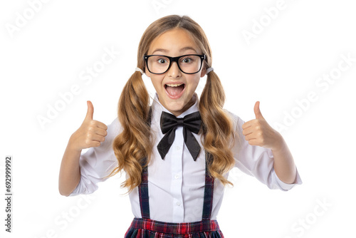 Schoolgirl showing thumbs up, isolated on white. Study well and you will be successful. No more vision problems.