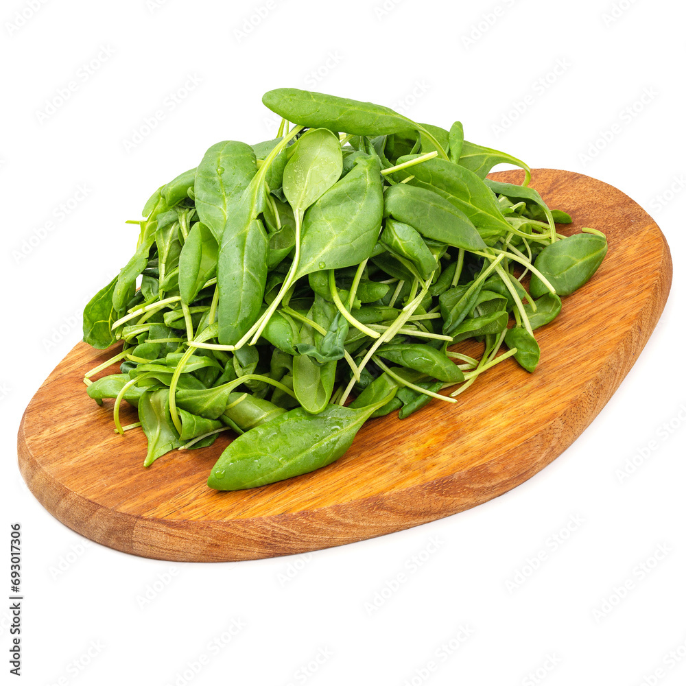Spinach leaves on a wooden board on a white background, isolated Spinach leaves on a wooden board on a white background, isolated