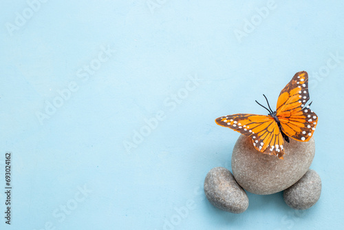 Marble stones with butterfly - calmness and harmony background. Maditation concept