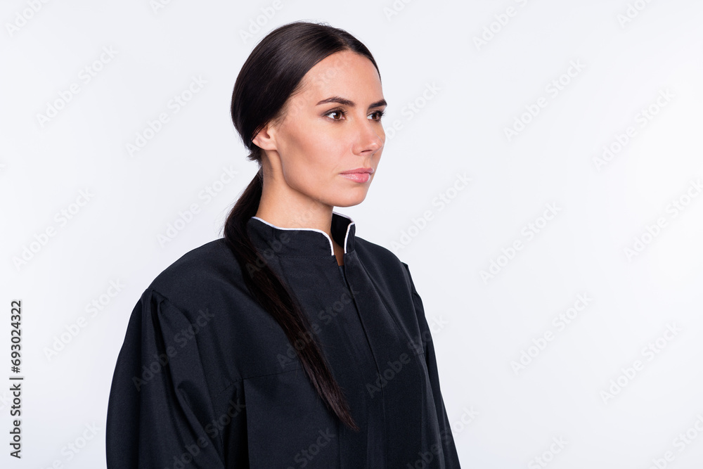 Profiel side photo of serious woman attorney judge look copyspace wear black robe coat isolated on white color background Profiel side photo of serious woman attorney judge look copyspace wear black robe coat isolated on white color background