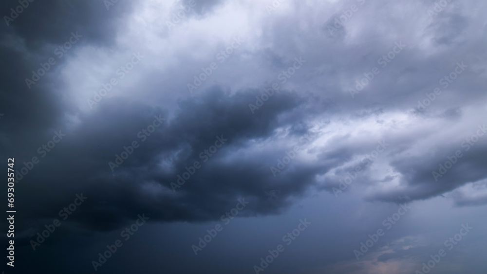 Dark sky with stormy clouds. Dramatic sky rain,Dark clouds before a thunder-storm. Dark sky with stormy clouds. Dramatic sky rain,Dark clouds before a thunder-storm.