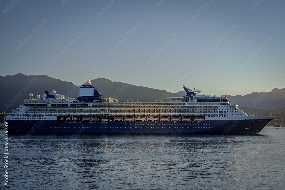Luxury cruiseship cruise ship liner Summit arrival sail into port of Vancouver, BC Canada from Alaska Last Frontier adventure cruising during sunrise with beautiful scenic view Luxury cruiseship cruise ship liner Summit arrival sail into port of Vancouver, BC Canada from Alaska Last Frontier adventure cruising during sunrise with beautiful scenic view