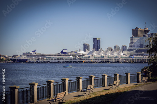 Luxury cruiseship cruise ship liner Summit arrival sail into port of Vancouver  BC Canada from Alaska Last Frontier adventure cruising during sunrise with beautiful scenic view 