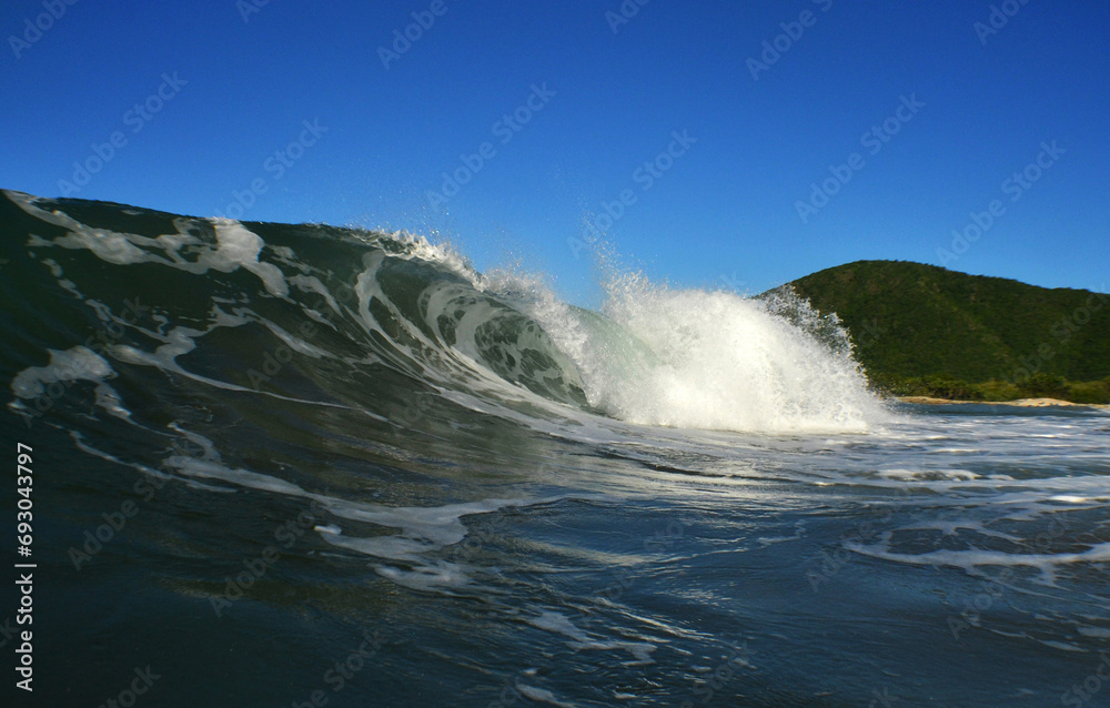 a beautiful wave on a beach in the caribbean sea