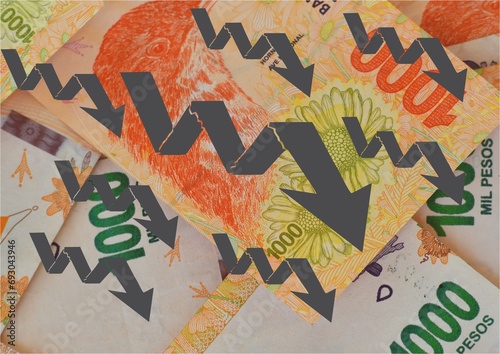 background of Argentine peso bills with denomination of 1000 pesos and grey arrows going down, concept of devaluation of the Argentine peso