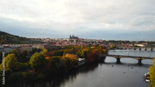Aerial view of Prague city (Czech Republic) - famous bridges on Vltava river and old town in autumn time (Fall season). Prague from above during the sunset.