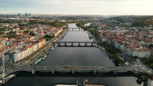 Aerial view of Prague city (Czech Republic) - famous bridges on Vltava river and old town in autumn time (Fall season). Prague from above during the sunset.