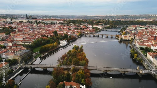 Aerial view of Prague city (Czech Republic) - famous bridges on Vltava river and old town in autumn time (Fall season). Prague from above during the sunset.