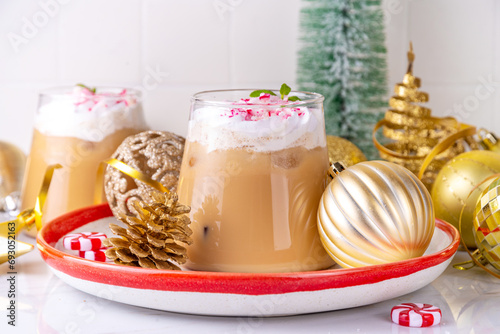 Iced Peppermint Mocha or Latte, Christmas coffee drink with crushed candy canes, whipped cream and mint syrup, festive holiday cold drink  photo