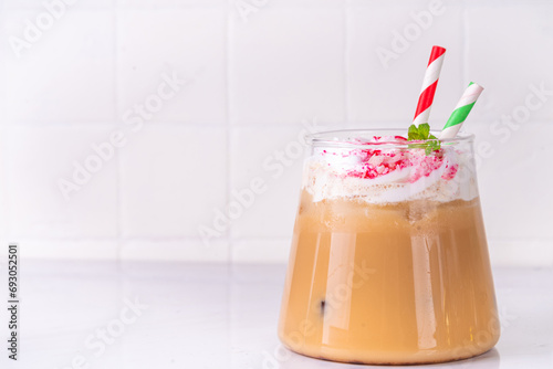 Iced Peppermint Mocha or Latte, Christmas coffee drink with crushed candy canes, whipped cream and mint syrup, festive holiday cold drink  photo