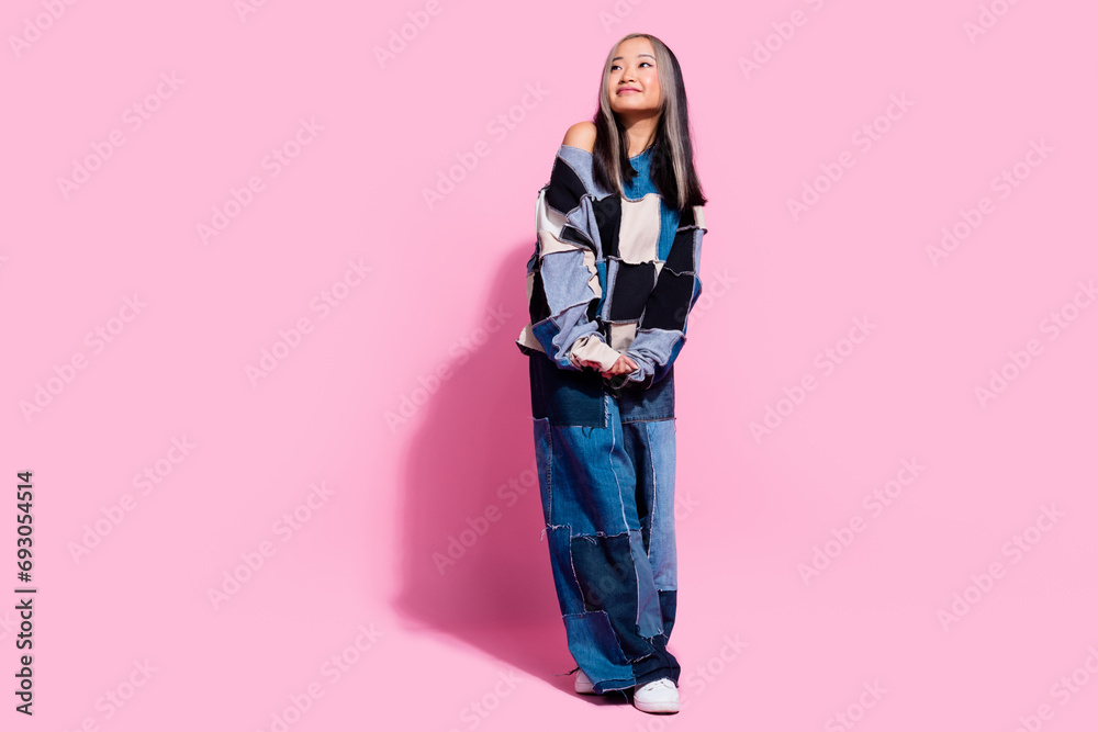 Full body portrait of gorgeous positive lady look interested empty space contemplate isolated on pink color background Full body portrait of gorgeous positive lady look interested empty space contemplate isolated on pink color background