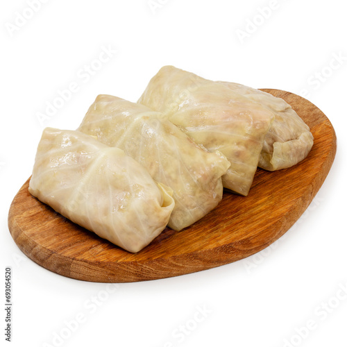 Cabbage stuffed with minced meat on a wooden board on a white background, isolated