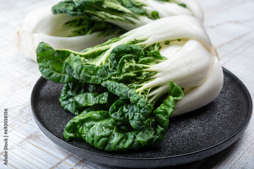 Young organic white bok choy or bak choi Chinese cabbage ready to cook - obrazy, fototapety, plakaty 