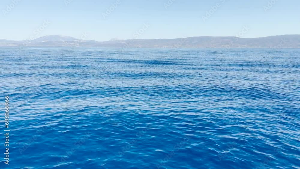 Blue Agean Sea with rolling swells, Hydra, Greece. Blue Agean Sea with rolling swells, Hydra, Greece.