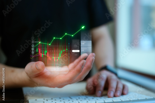 investment and finance concept, businessman holding virtual trading graph on hand, stock market, profits and business growth