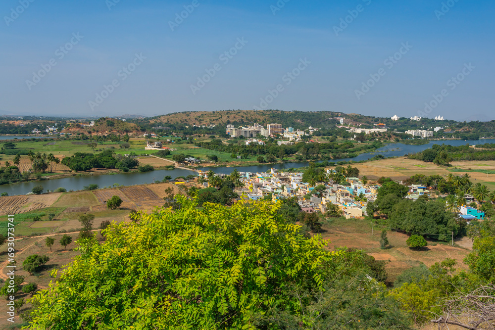 Landscape from Puttaparthi with the lake green trees,buildings, temple and ashram from Sai Baba