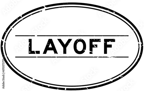 Grunge black layoff word oval rubber stamp in white background